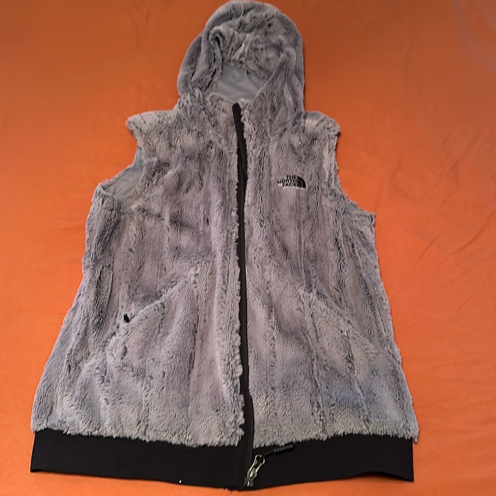 Women’s fuzzy hooded north face vest. Size medium. Excellent condition